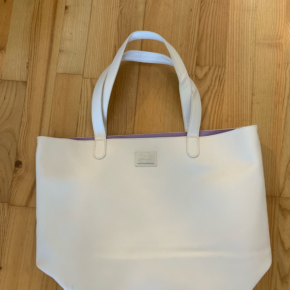 Vegan leather tote with Arbonne logo.